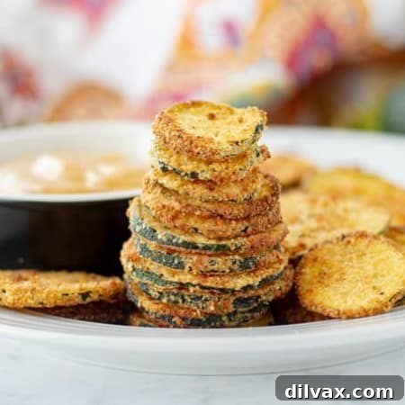 Crispy Cornmeal Breaded Zucchini Chips, a delicious and healthy snack for any occasion.