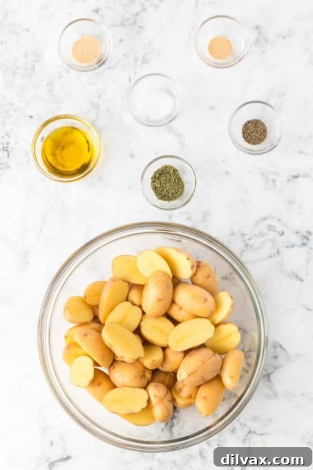 Perfectly Crispy Air Fryer Potato Bites 5 Ingredients for air fryer baby potatoes laid out on a board