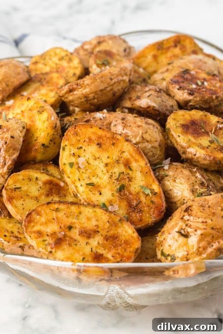 Perfectly Crispy Air Fryer Potato Bites 8 Seasoned baby potatoes in a bowl, ready to be air fried