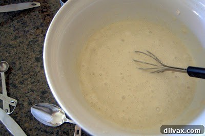 Delightful Eggless Vanilla Cardamom Cake 7 Cake batter with a few small lumps, ready to pour