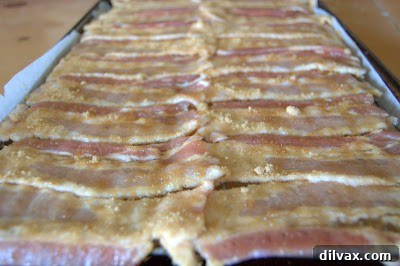 Bacon strips coated with brown sugar arranged on a wire rack