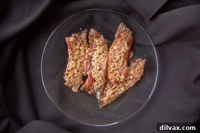 Close-up of freshly baked sugared pecan bacon on a wire rack