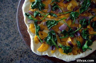 Mediterranean Roasted Vegetable Spinach and Feta Pizza 12 Pizza topped with sautéed spinach over roasted vegetables