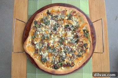 Mediterranean Roasted Vegetable Spinach and Feta Pizza 14 Baked pizza with golden crust, melted cheese, and roasted vegetables, fresh out of the oven