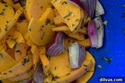 Mediterranean Roasted Vegetable Spinach and Feta Pizza 4 Tossing butternut squash and red onion with olive oil, rosemary, thyme, garlic, salt, and pepper in a bowl
