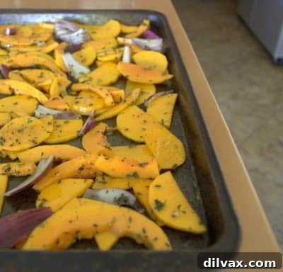 Mediterranean Roasted Vegetable Spinach and Feta Pizza 5 Butternut squash and red onion spread in a single layer on a baking sheet