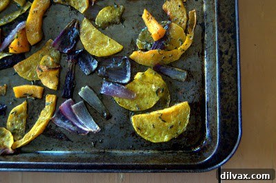Mediterranean Roasted Vegetable Spinach and Feta Pizza 6 Roasted butternut squash and red onion on a baking sheet, golden brown and tender