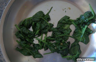 Mediterranean Roasted Vegetable Spinach and Feta Pizza 8 Sautéed spinach ready to be added to the pizza