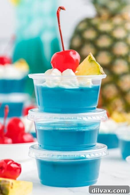 Whip Up Blue Hawaiian Jello Shots 8 A stack of vibrant blue jello shots ready for a party.