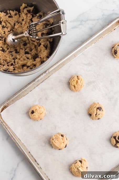 Crispy Salty Sweet Chocolate Chip Cookies 7 Chocolate chip cookie dough with visible potato chips, ready to be baked.