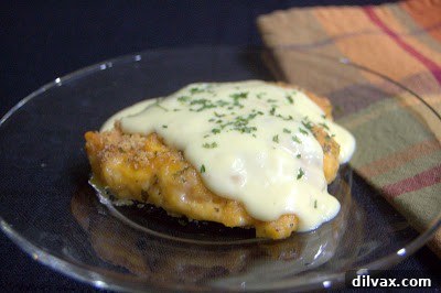 Crispy Cheddar Chicken Day 319 8 Two pieces of Crispy Cheddar Chicken served on a plate with cream sauce on the side.