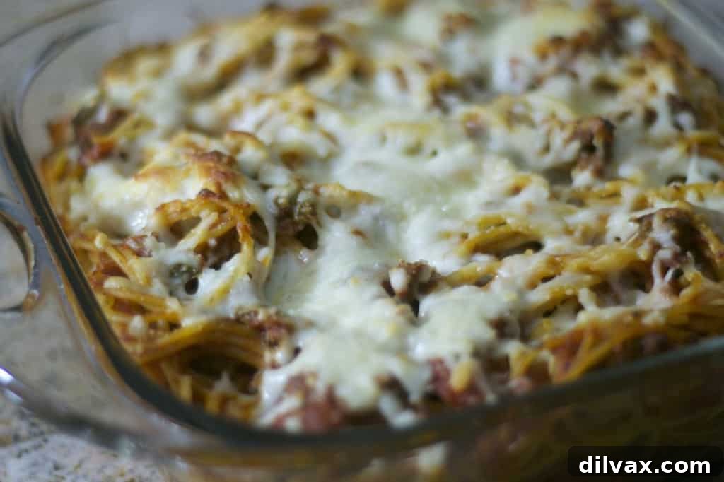Baked Spaghetti casserole with melted mozzarella and rich tomato sauce