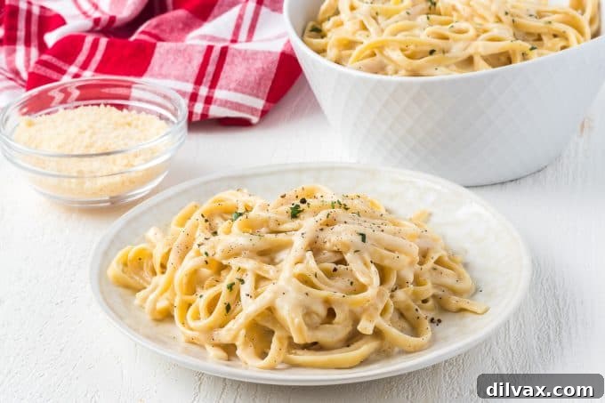 Velvety Garlic Alfredo Fettuccine 2 Creamy Garlic Fettuccine Alfredo with roasted garlic cloves on top