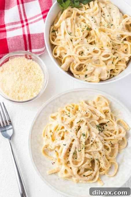 Velvety Garlic Alfredo Fettuccine 7 A generous serving of Fettuccine Alfredo topped with fresh Parmesan cheese and herbs
