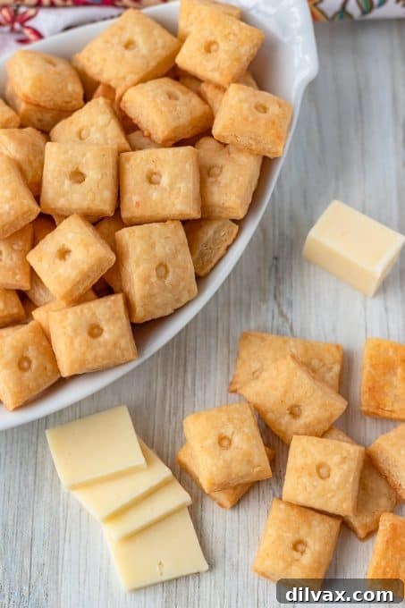 Handcrafted Cheesy Crisps 6 A batch of golden-brown homemade cheese crackers cooling on a wire rack.