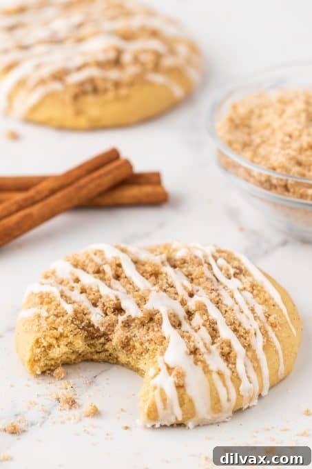 Cinnamon Streusel Cookies 10 A plate of Coffee Cake Cookies with a visible cinnamon swirl inside, and topped with streusel and glaze.