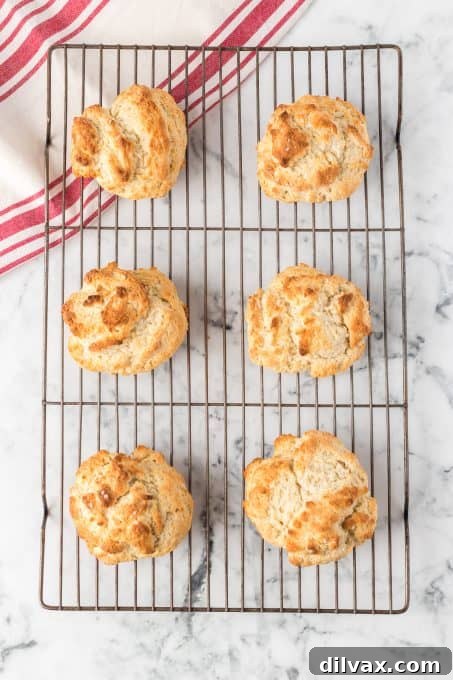 Golden brown Bisquick™ shortcake biscuits cooling on a wire rack