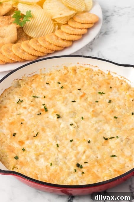 Another enticing shot of the baked artichoke dip, emphasizing its golden-brown top.