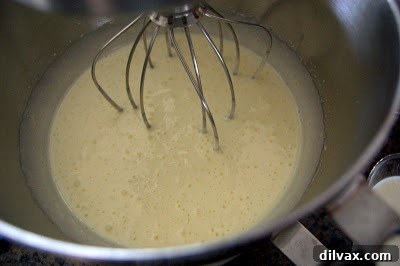 Close-up of fluffy egg and sugar mixture in a bowl