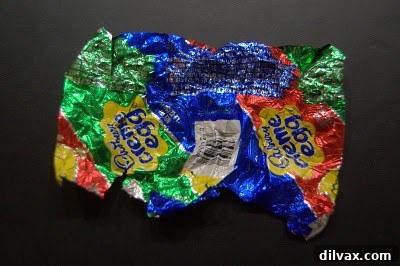 A close-up image of a vibrant Cadbury Creme Egg, a beloved seasonal chocolate treat.