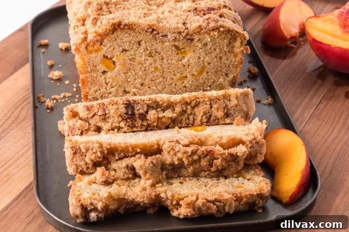 Sun-Kissed Peach Loaf 2 A beautifully baked loaf of Peach Bread with a golden cinnamon crumb topping.