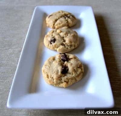 Delicious Brown Butter Coconut Krispie Chocolate Chip Cookies cooling on a rack, ready to be enjoyed.