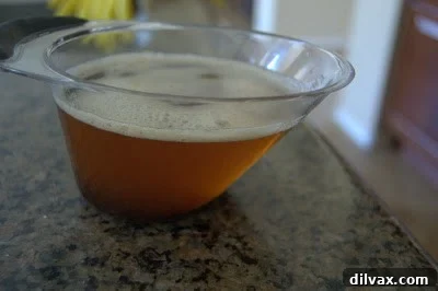 A freshly baked Brown Butter Coconut Krispie Chocolate Chip Cookie, perfectly golden.
