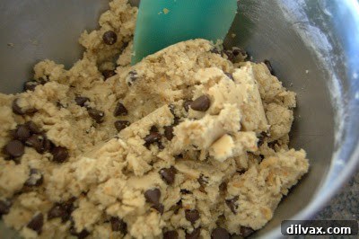 A stack of perfectly baked Brown Butter Coconut Krispie Chocolate Chip Cookies.