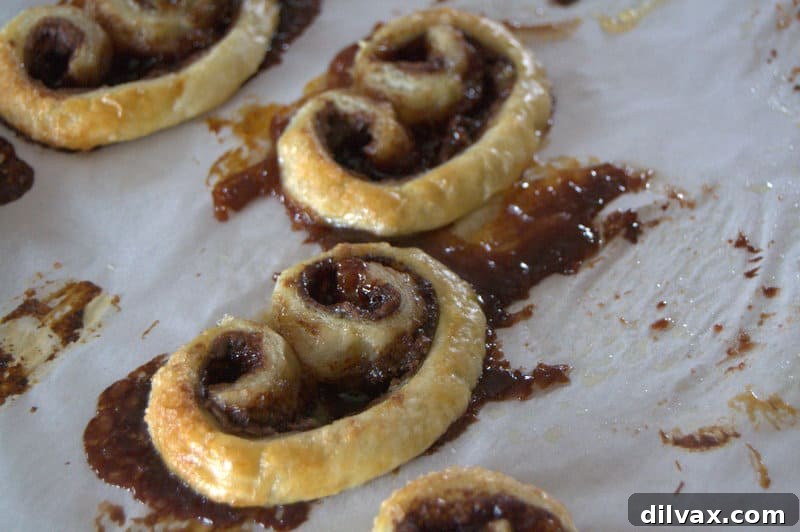 Close-up of the melted, caramelized Nutella and orange marmalade on parchment paper, a delicious bonus.