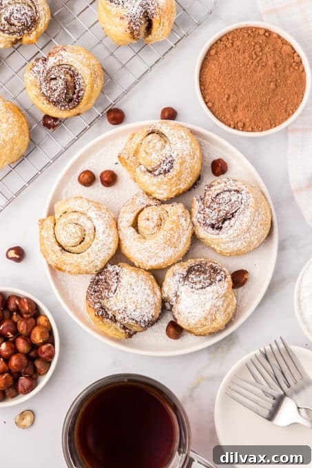 Decadent Nutella Cruffins 9 A plate of freshly baked Nutella muffin croissants.