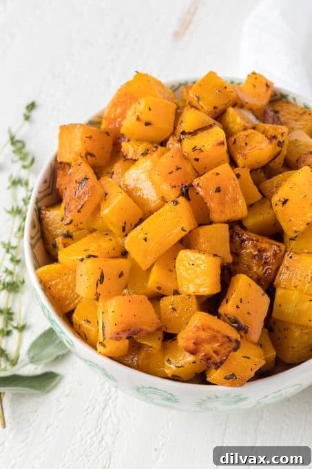 Golden Roasted Butternut Squash 6 Cooked Butternut Squash with fresh herbs in a serving bowl