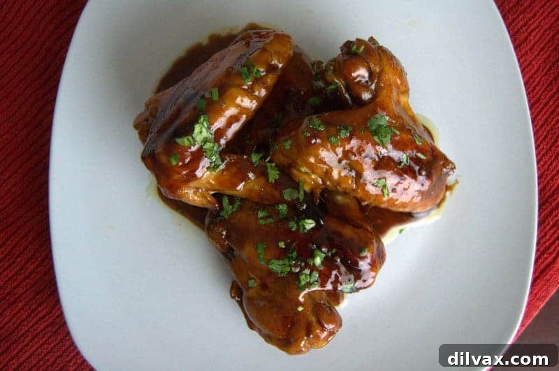 Baked Chinese Chicken Wings with a sticky glaze and fresh parsley