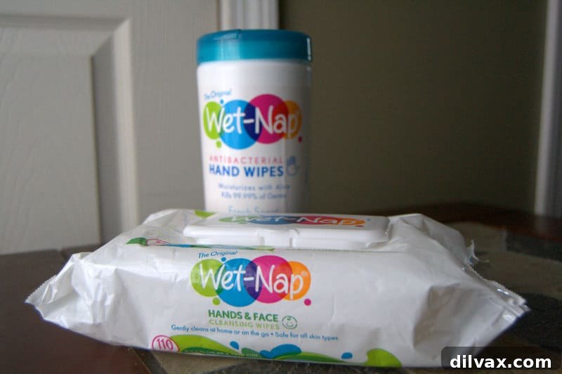 Wet-Nap wipes next to a plate of messy food, emphasizing convenience