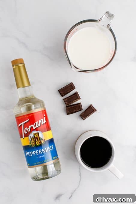 Crisp Mint Cocoa 4 Ingredients for DIY Peppermint Mocha laid out on a table