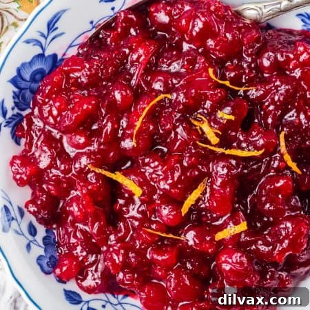 A bowl of fresh cranberries made into a sauce.