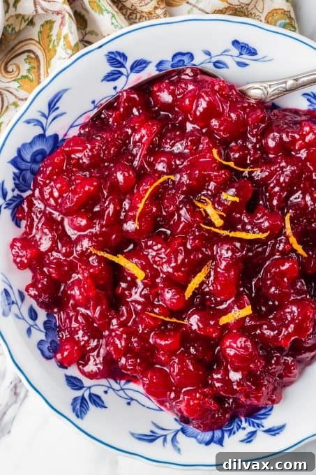A bowl of fresh cranberries made into a sauce.