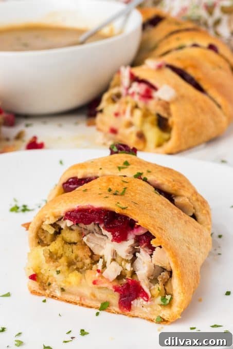 Close-up of a slice of Turkey Crescent Ring showing the layers of filling.