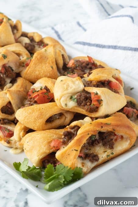 Fiesta Pockets 7 Taco seasoned meat with tomatoes and cheese in crescent dough.