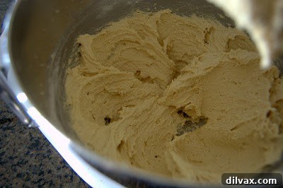 Dry ingredients combined with wet ingredients, forming cookie dough.