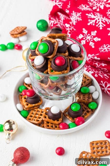 Sweet and Salty Pretzel Magic 9 A mix of pretzels, mint Hershey Kisses and mint M&M's, highlighting ingredients for an easy Christmas snack.