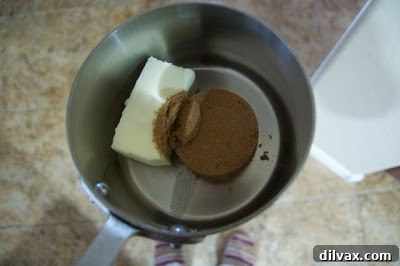 Day 293: A Sticky Letdown 2 Butter and dark brown sugar mixture boiling in a saucepan for toffee preparation