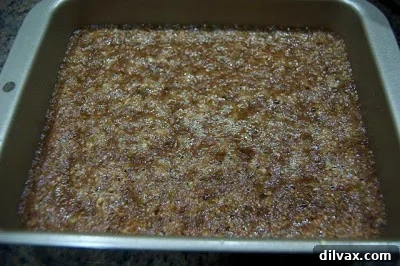 Semi-sweet chocolate chips sprinkled over the hot, baked toffee mixture in the pan