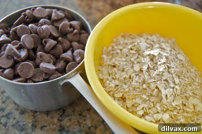 Freshly baked Peanut Butter Oatmeal Chocolate Chip Cookies on a cooling rack
