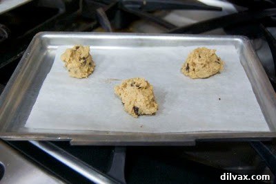 Cookie dough balls on a small baking sheet