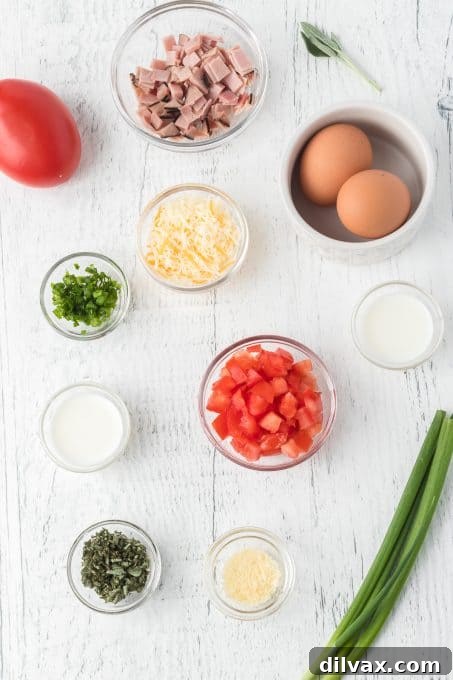 A selection of fresh ingredients for Sage and Ham Baked Eggs, including eggs, ham, sage, and cheese.
