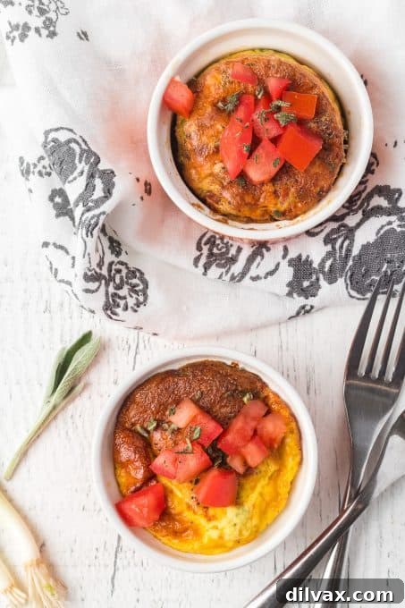 A serving of baked eggs with ham and cheese in a ramekin.