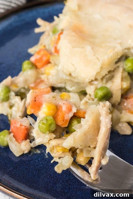 Comforting Turkey Pot Pie 8 A pot pie filled with vegetables and turkey, ready to bake.