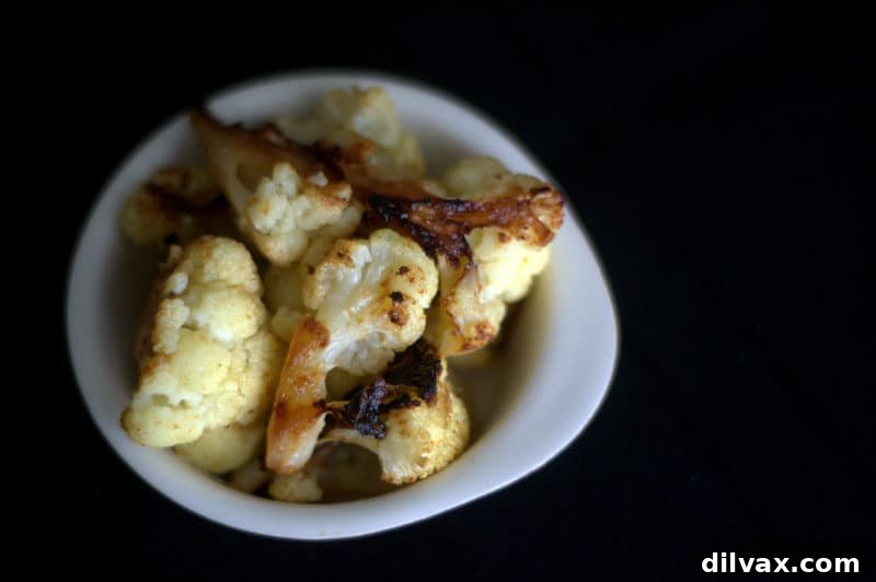 Roasted Teriyaki Cauliflower - Closeup of glazed cauliflower florets, showcasing their caramelized edges and rich color, ready for serving.