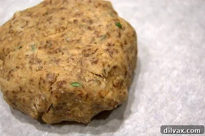 Crunchy Homemade Wheat Crackers 3 Dough rolled out between parchment paper before cutting.
