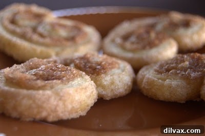 Cinnamon Sugar Palmiers are the perfect treat to accompany your morning coffee and are easily made from pastry dough and a cinnamon sugar combination.